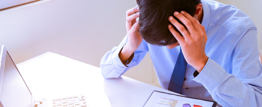 An employee stressed over data analytics