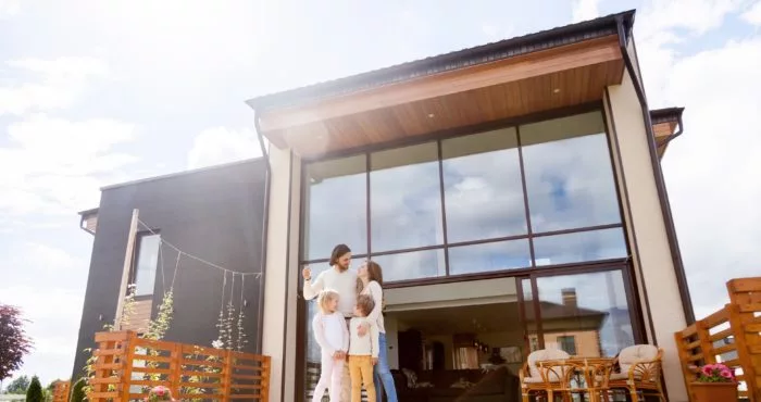 Family in front of new house