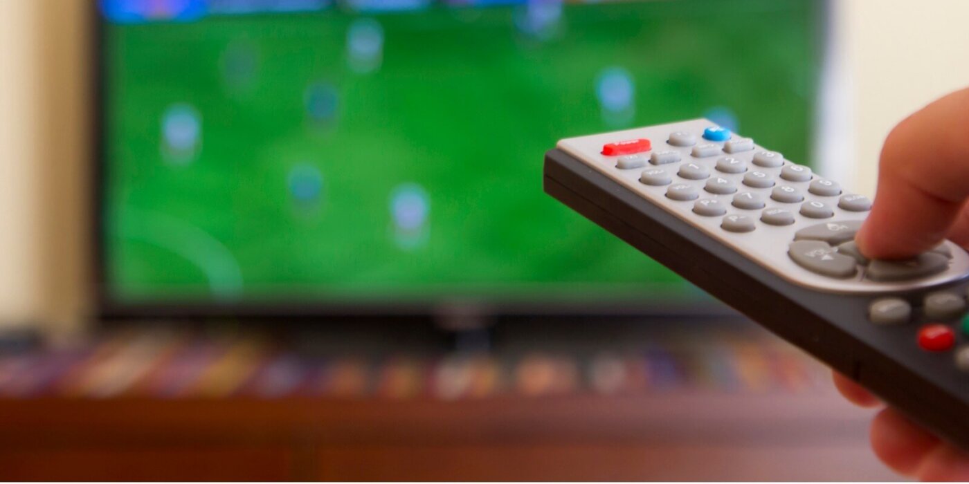television remote control in human hands
