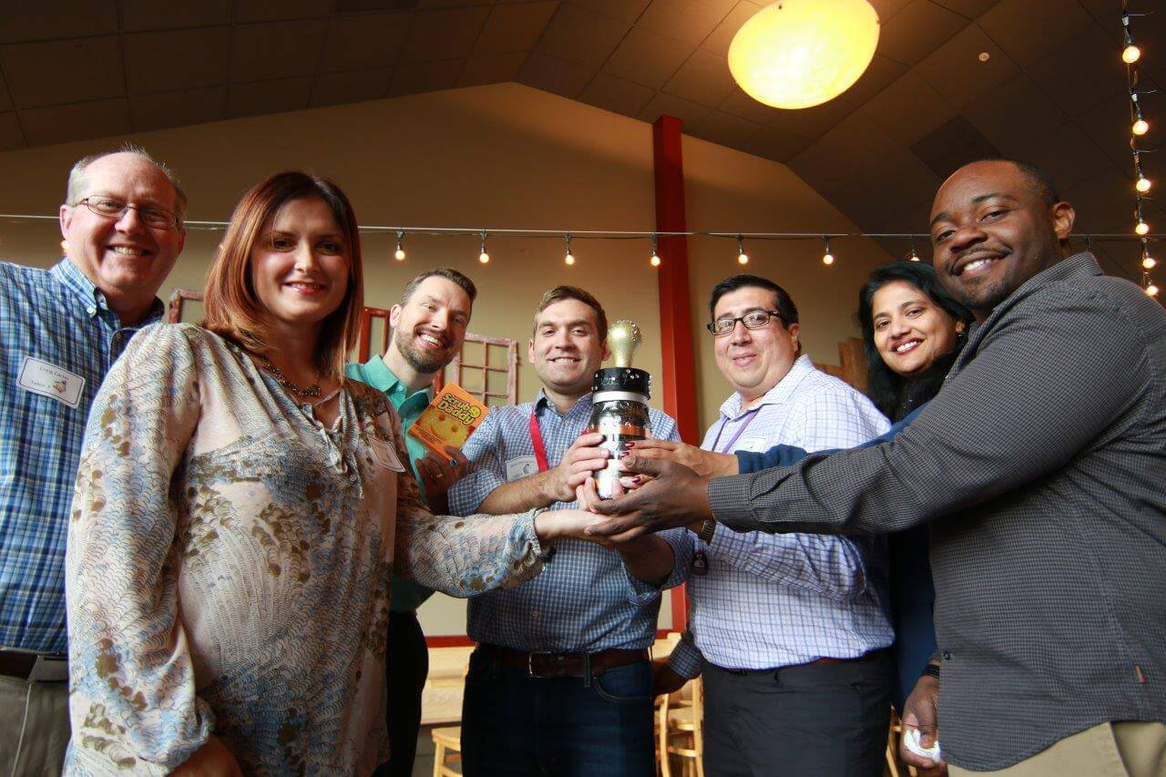 Innovation Maker winners with trophy