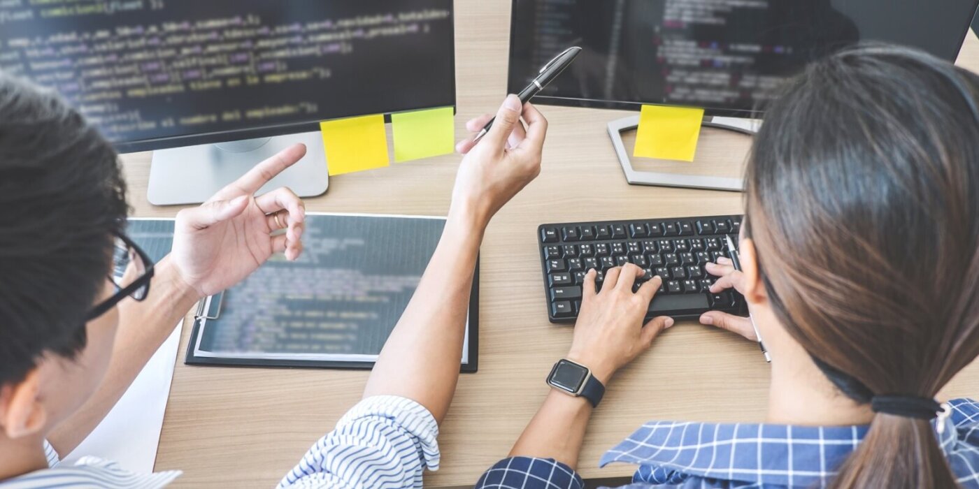 Two people coding together