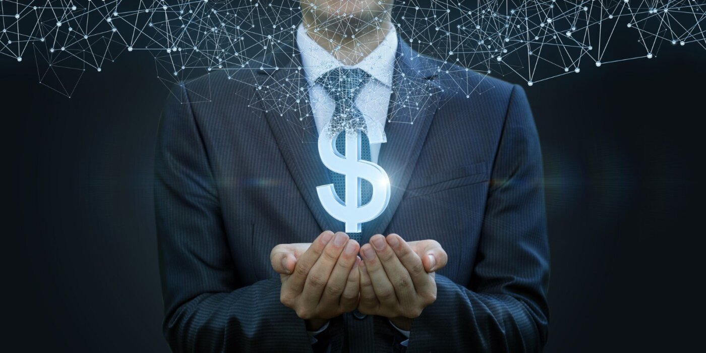 in the hands of a businessman appears the dollar