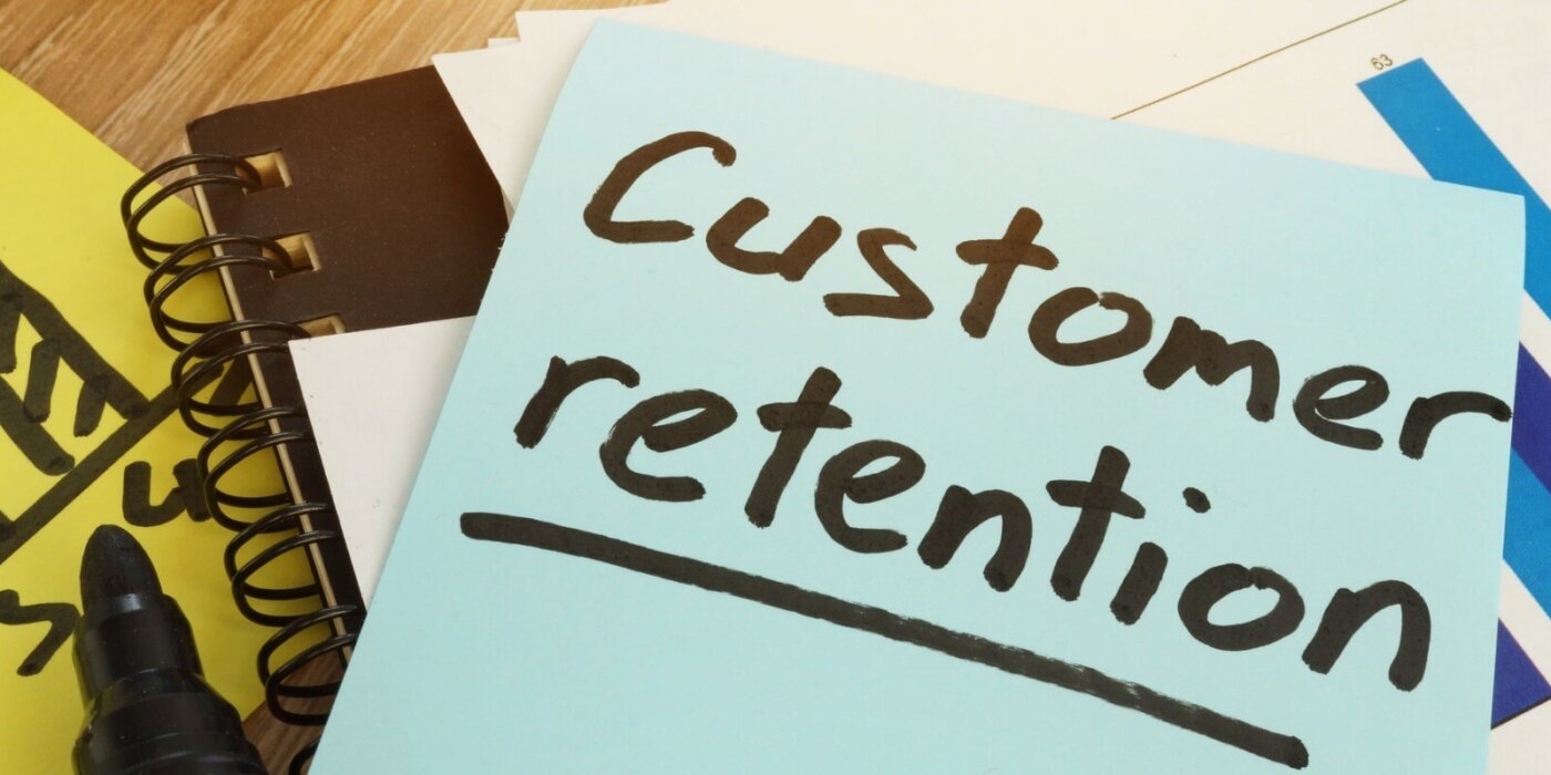 Customer Retention written on a sticky note