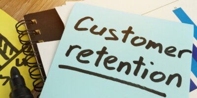 Customer Retention written on a sticky note