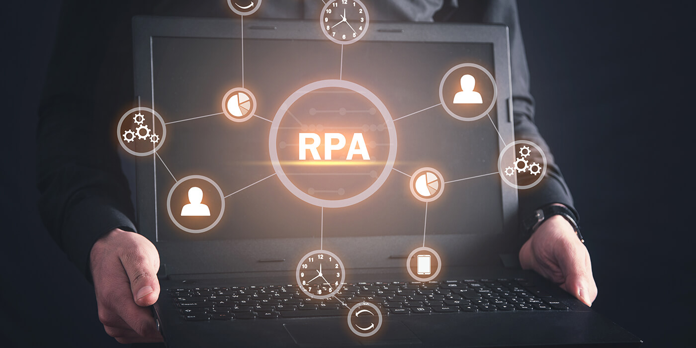 A man holds a laptop with the acronym RPA on the screen. Icons representing various automations float around it.