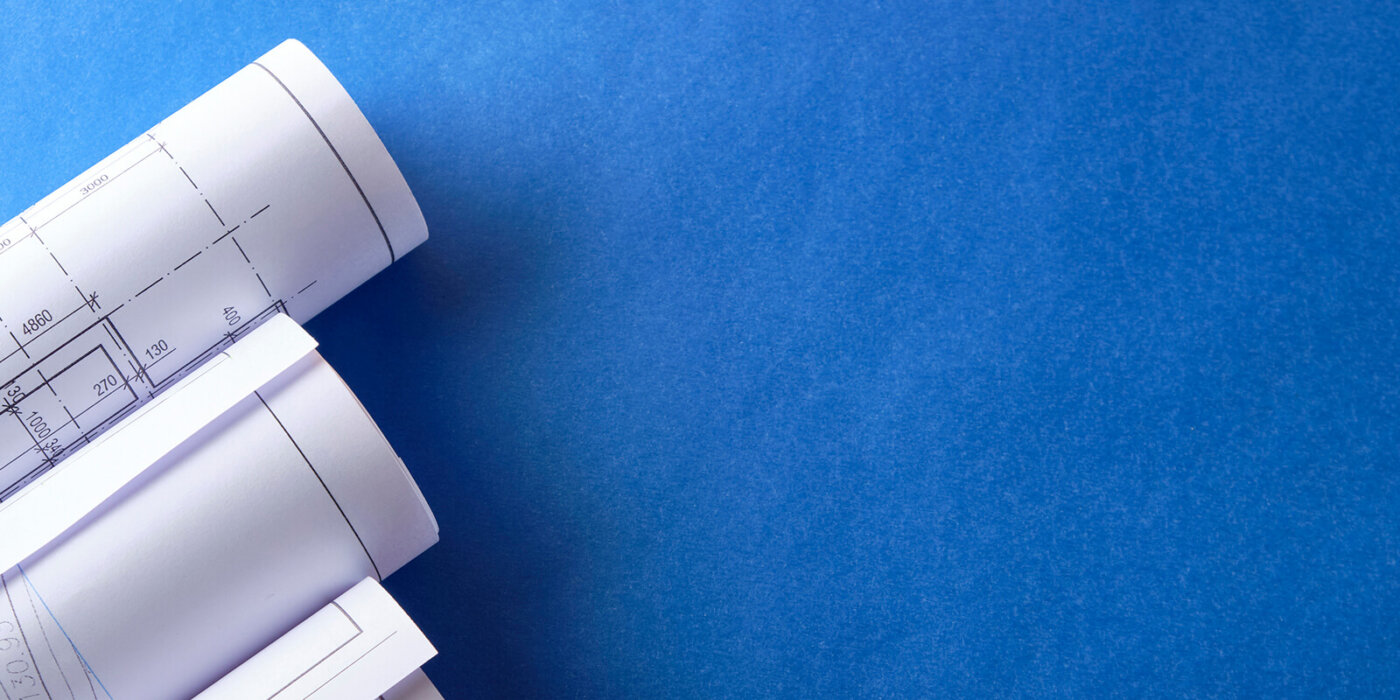 Blueprints on a blue table