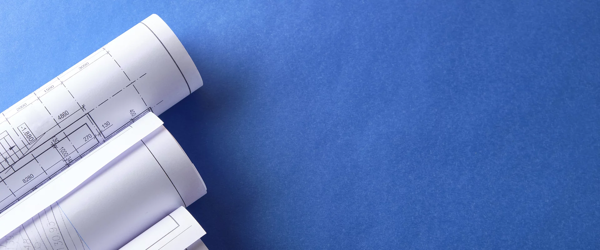 Blueprints on a blue table