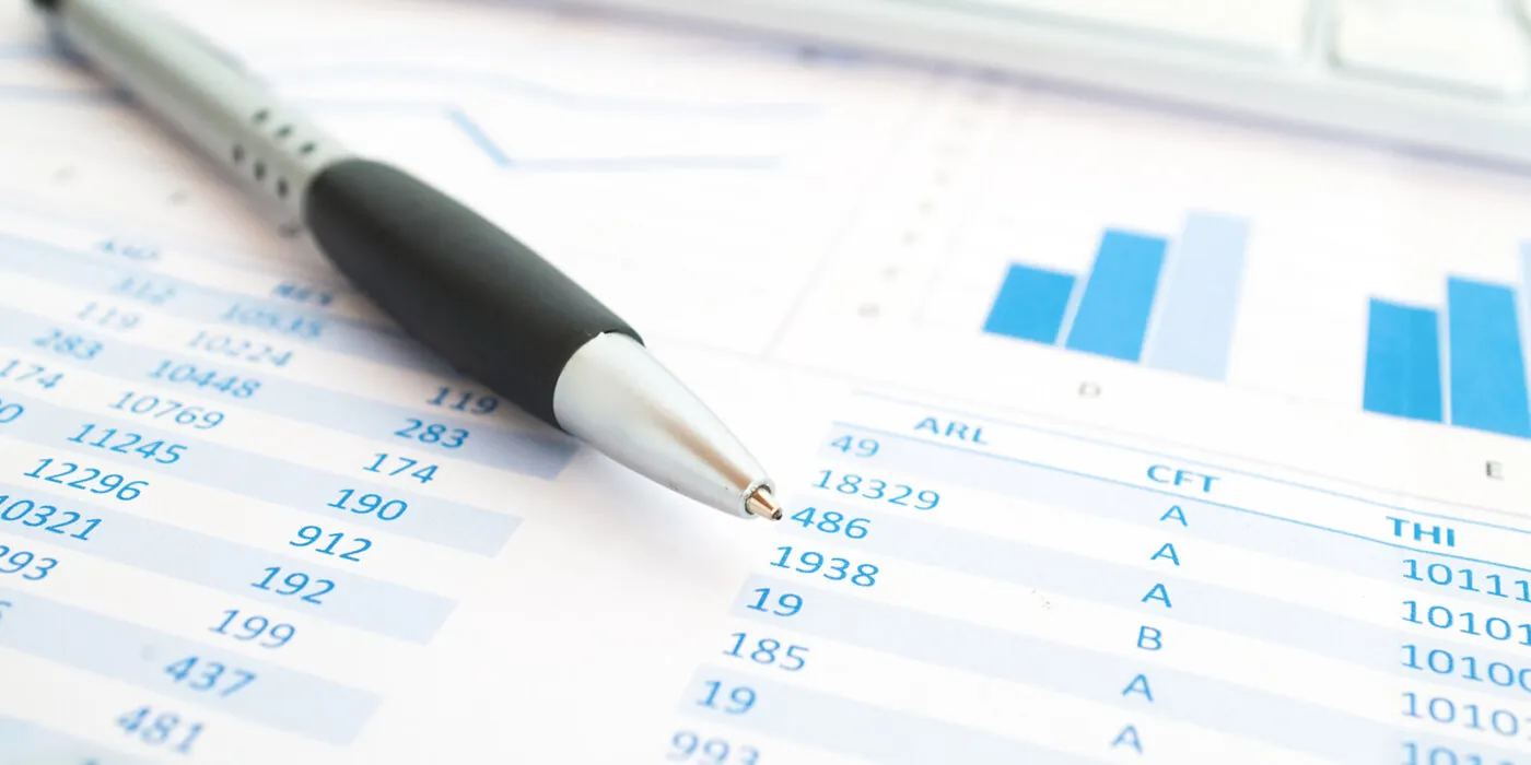Pen an paper with data on it