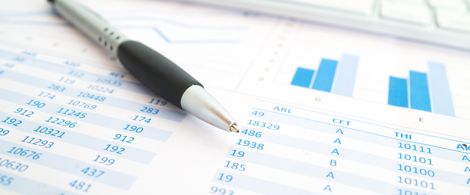 Pen an paper with data on it