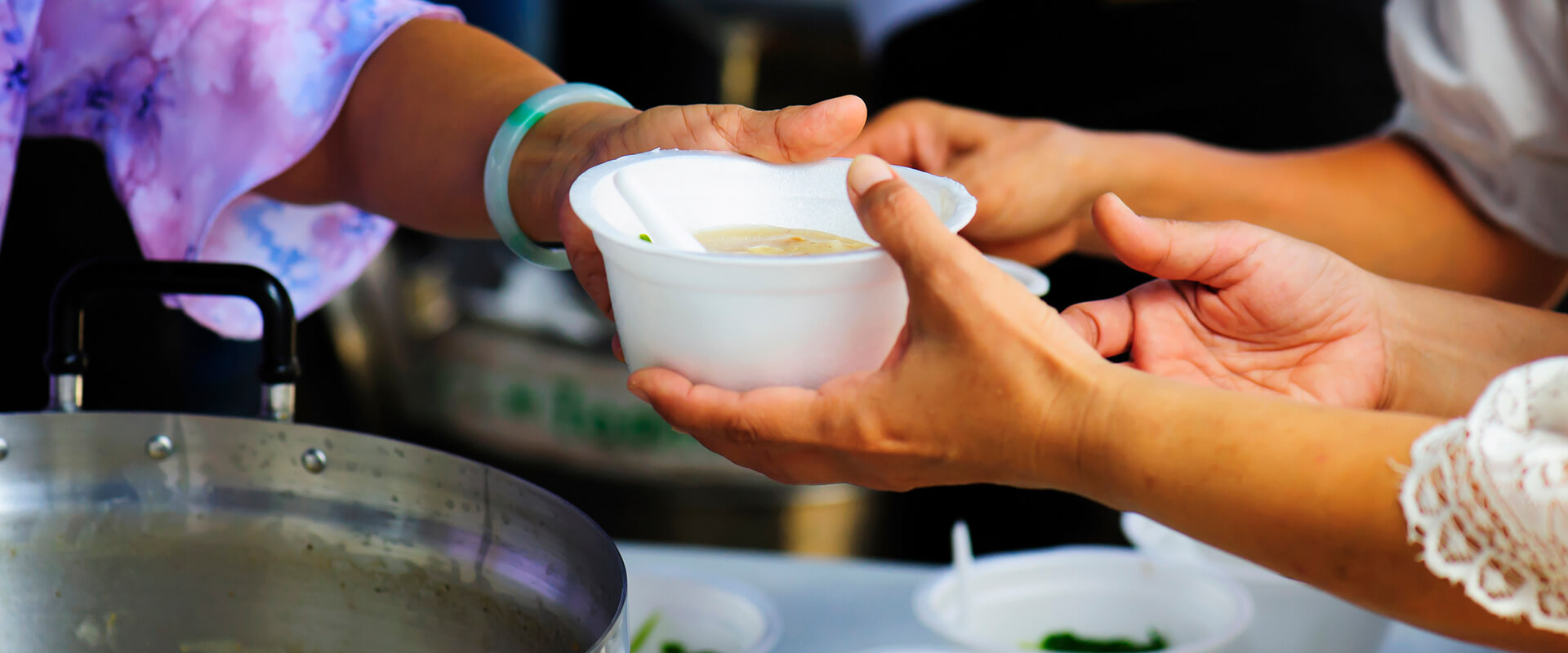 Passing a bowl of soup