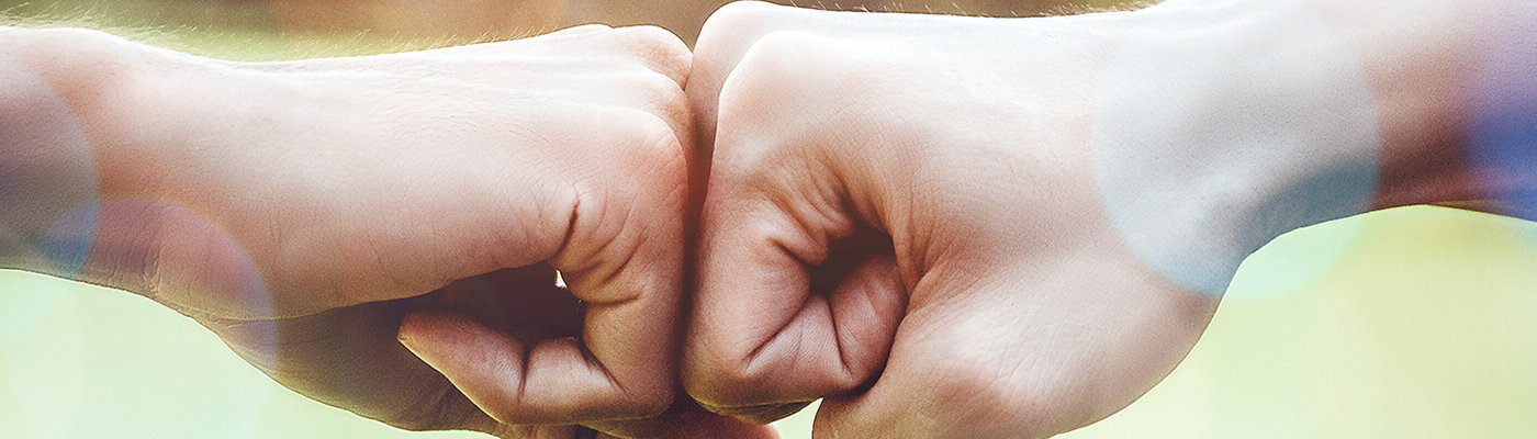 two fists bumping