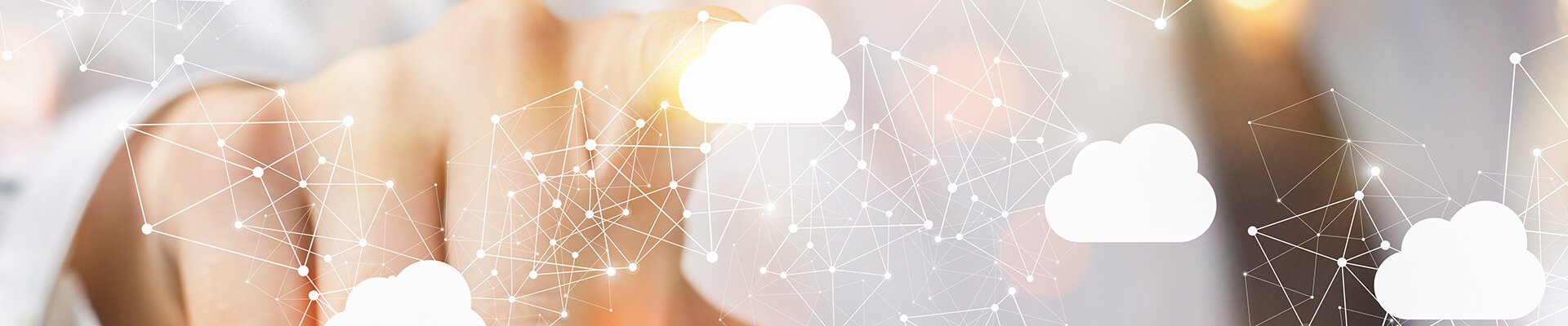 A person's finger selects a cloud icon out of a connected network.