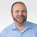 A headshot of Frank Ready, a senior consultant at RevGen Partners