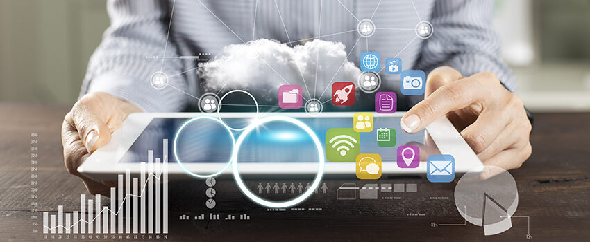 Icons of marketing channels as well as transparent graphs are overlaid on an image of a person holding a tablet, indicating marketing analysis.