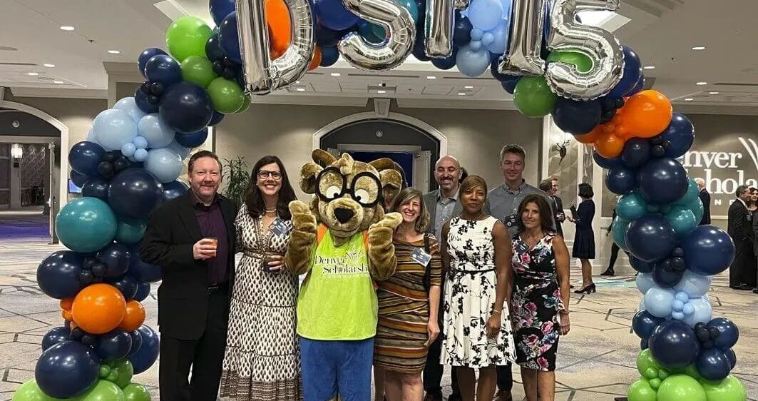 RevGen volunteers pose with the Denver Public Schools mascot at the DPS Scholarship Gala