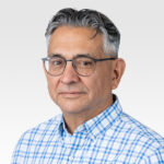 A headshot of Paul Flores, RevGen Partners Architect