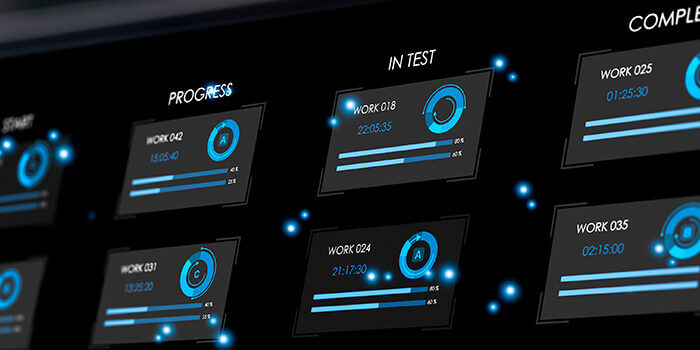 A laptop screen displays the phases of software development in various states of completion, as indicated by blue circles.