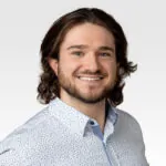 A headshot of Alex Champagne