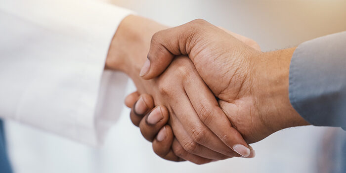 A close-up shot of a handshake