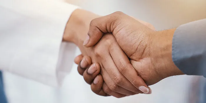 A close-up shot of a handshake