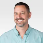 A headshot of RevGen manager Edward Johnson