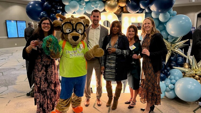 RevGeners pose with Future, the Denver Scholarship Foundation mascot at the 2024 DSF Gala