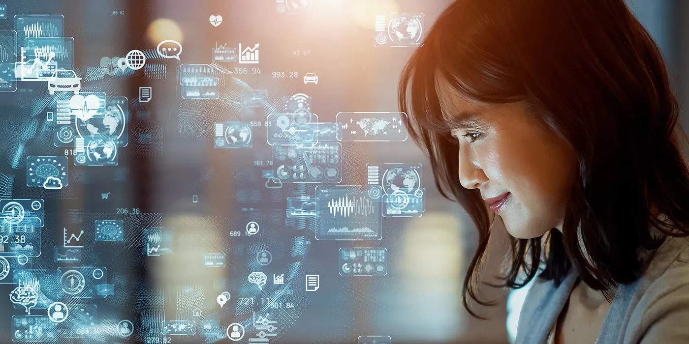 An asian woman smiles at holographic icons representing her digital world